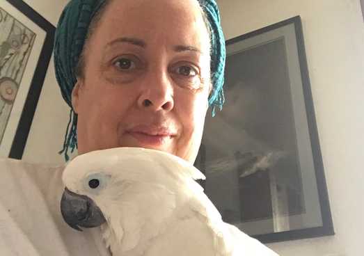 cousin Cabrini with her pet cockatoo