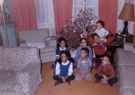 Christmas 1964 with all 7 Miller children in front of a Christmas tree