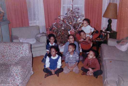 Christmas 1964 with all 7 Miller children in front of a Christmas tree