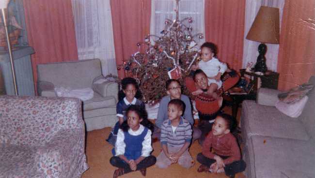 Christmas 1964 with all 7 Miller children in front of a Christmas tree