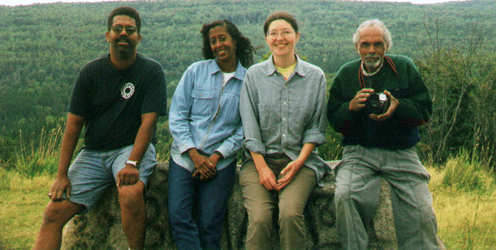 Wayne Miller, Deborah Miller, Tatiana Schlaffer, Leon Smith sitting on a rock