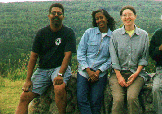 Wayne Miller, Deborah Miller, Tatiana Schlaffer, Leon Smith sitting on a rock