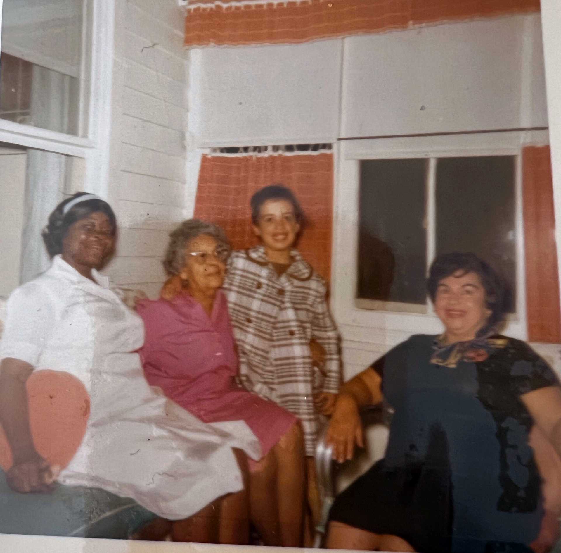 a photo of 4 women on a porch Cabrini and her mother